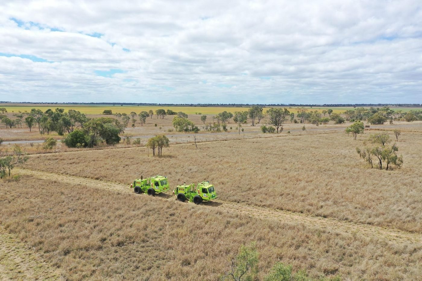Aerial view of two vibroseis units on an access track, Bowen Basin, Queensland