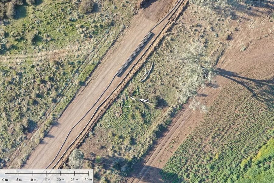 Orthomosaic aerial imagery of seismic survey line and access track with scale reference